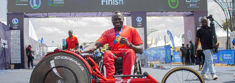 Michael Panther poses for a photo after finishing the 42-km race at the Standard Chartered Marathon in Nairobi on Sunday.