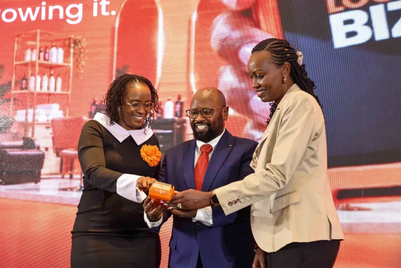 LOOP chief commercial officer Sheila Kimani, Visa country manager John Njoroge and NCBA Group director, transactional solutions Sally Chege, with the newly launched LOOP PDQ machine during the Loop Biz + launch in Nairobi/ HANDOUT