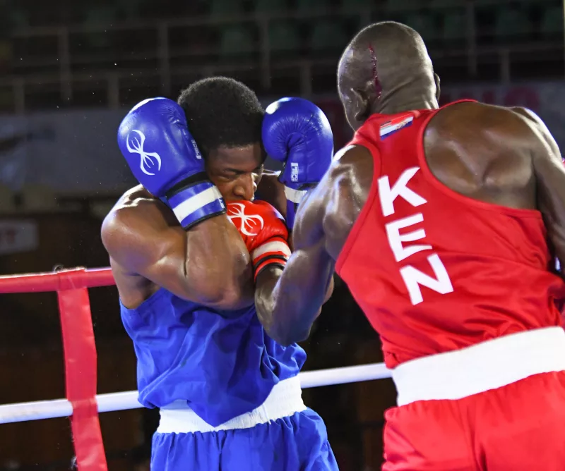 Emmanuel Chukwuka (NGR) is punched by Edwin Okong'o (KEN)