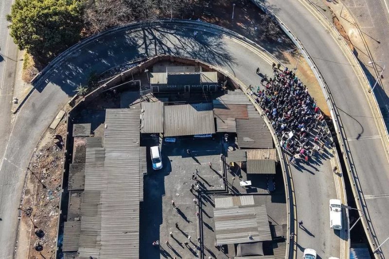 An aerial drone photo taken on June 30, 2026 shows protesters marching during a massive demonstration against illegal immigration in Johannesburg, South Africa. (Photo by Shiraaz Mohamed/Xinhua)