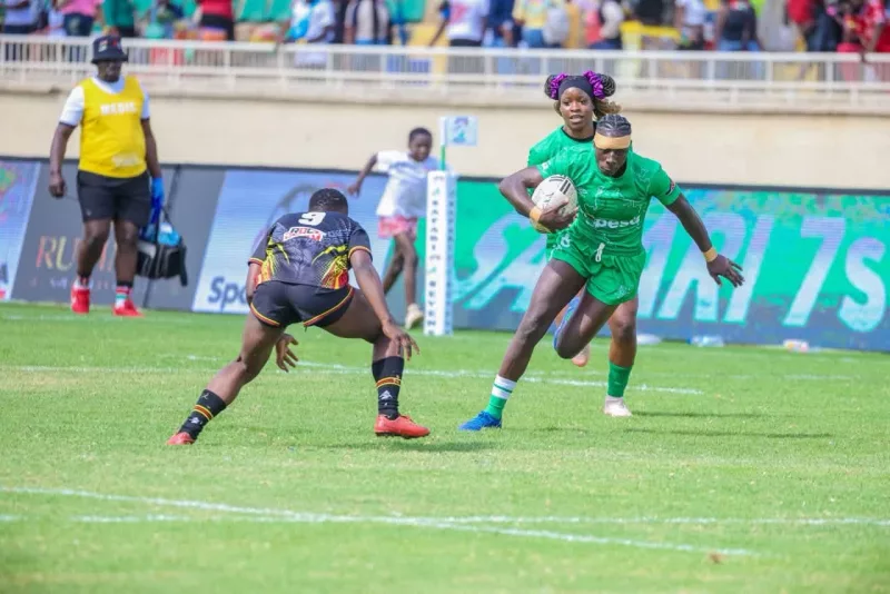 Kenya Lionesses Freshia Oduor sidesteps an  Ugnadan opponent