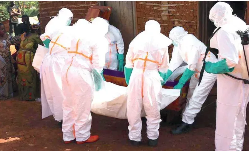 Medical workers in protective suits transfer the body of an Ebola victim in Mongbwalu, Ituri province, eastern DRC on May 24, 2026. /XINHUA