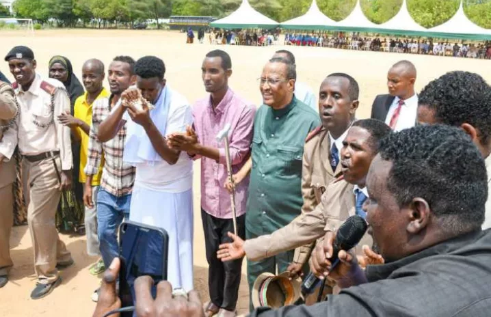 Garissa Governor Nathif Jama joins traditional dancers during Mashujaa Day celebrations /STEPHEN ASTARIKO