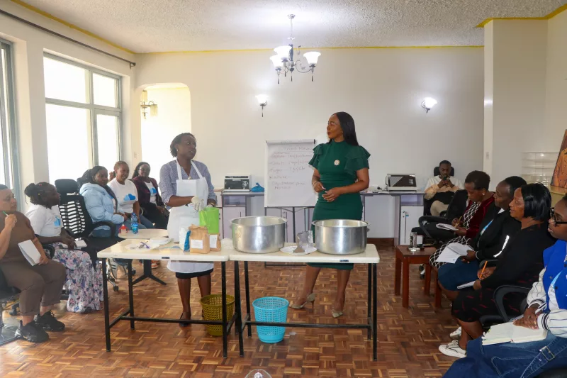 Clean Start Africa CEO and co-founder watches as post-incarnated women are trained on yoghurt making at Clean Start Offices on September 3 / bird story agency