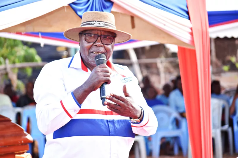 Former Mwingi North MP, John Munuve, addressing mourners during the burial ceremony of retired teacher, Aaron Musya aka Kisinga, at Kyuso village in Mwingi North on Saturday/Musembi Nzengu.