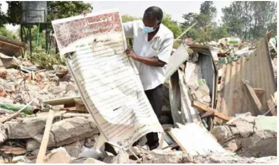 An elder on the debris of Kibos Mosque that was demolished to pave way for renovation of Nakuru Kisumu Railway line /KNA