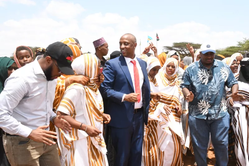 Isiolo Governor Abdi Guyo dancing with locals during Mashujaa Day Celebrations at Isiolo Central Subcounty on Tuesday