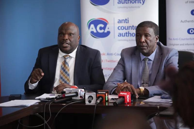Anti-Counterfeit Authority director-general Robi Mbugua with board chairperson Nelson Gaichuhie during a press conference in Nairobi