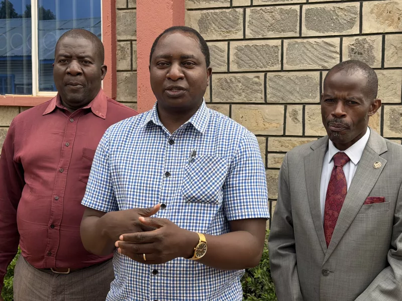 Bishop Bonface Simani (c) with Bishop Dr. Samuel Weche and member Richard Mangoli at a meeting in Eldoret