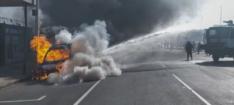 Cars torched, shops looted as anti-migrant violence erupts in South Africa