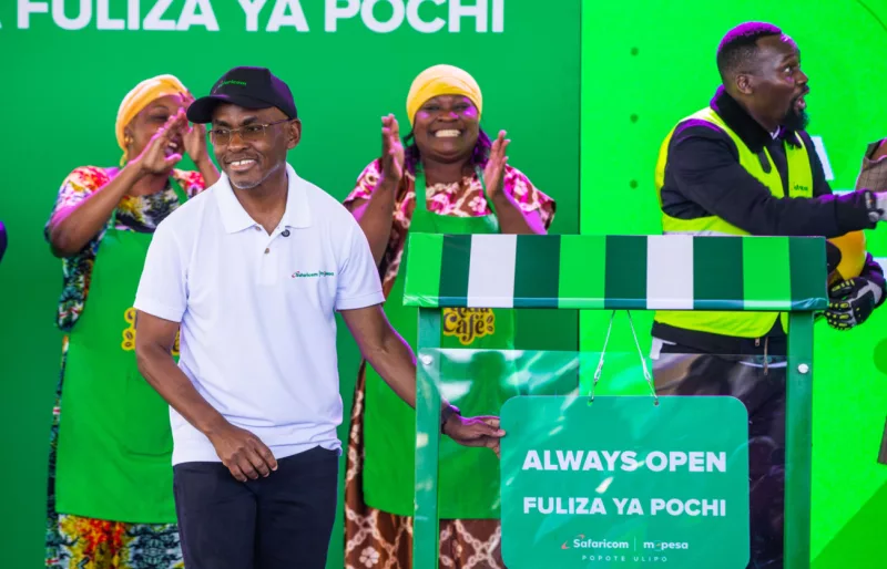Safaricom Group CEO Peter Ndegwa unveils Fuliza Ya Pochi in Thika. The overdraft facility enables qualifying Pochi La Biashara merchants to complete business payments when their wallet balance is insufficient /HANDOUT