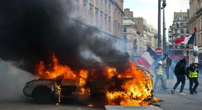 This photo taken on Oct. 17, 2026 shows a burning vehicle during a protest in Paris, France. (Xinhua/Wu Huiwo)