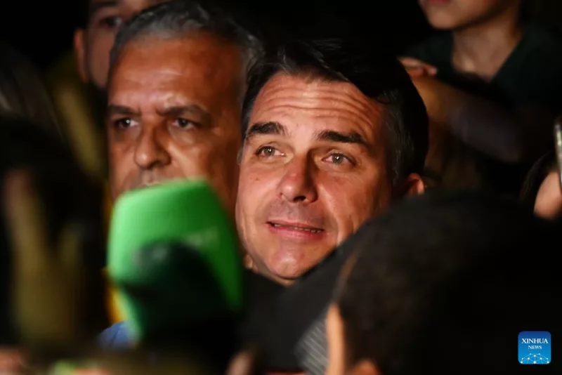 Flavio Bolsonaro (C), presidential candidate of Brazil's Liberal Party, is seen after the announcement of the first-round results of the presidential election in Brasilia, Brazil, Oct. 4, 2026. (Xinhua/Lucio Tavora)