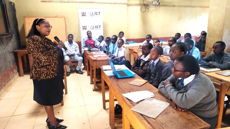 Ministry of Energy Director of ICT Lynn Nyongesa addressing JSS learners at Mumbi Comprehensive school in Kahuro, Murang'a, on October 19, 2026/ ALICE WAITHERA