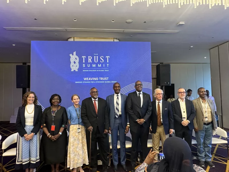 , Maj Gen (Rtd) Aphaxard Kiugu (C) with panelists  on peace and security at the Global Trust Summit on October 22, 2026