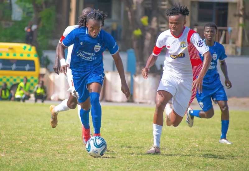Mombasa United forward Shawn Tune and Lennox Kimani of Homeboyz in their  Wednesday Premier League match at Police Sacco grounds