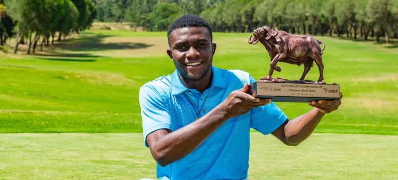 Godwin Okoko poses with his trophy after winnning the Rift Valley Championships